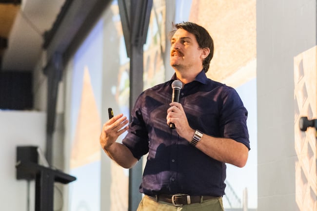 Laing O'Rourke's Dr Rowan Braham giving the keynote address at the HammerTech Community Event 2025