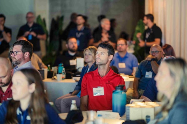 Participants in the HammerTech community event listening to the speakers.