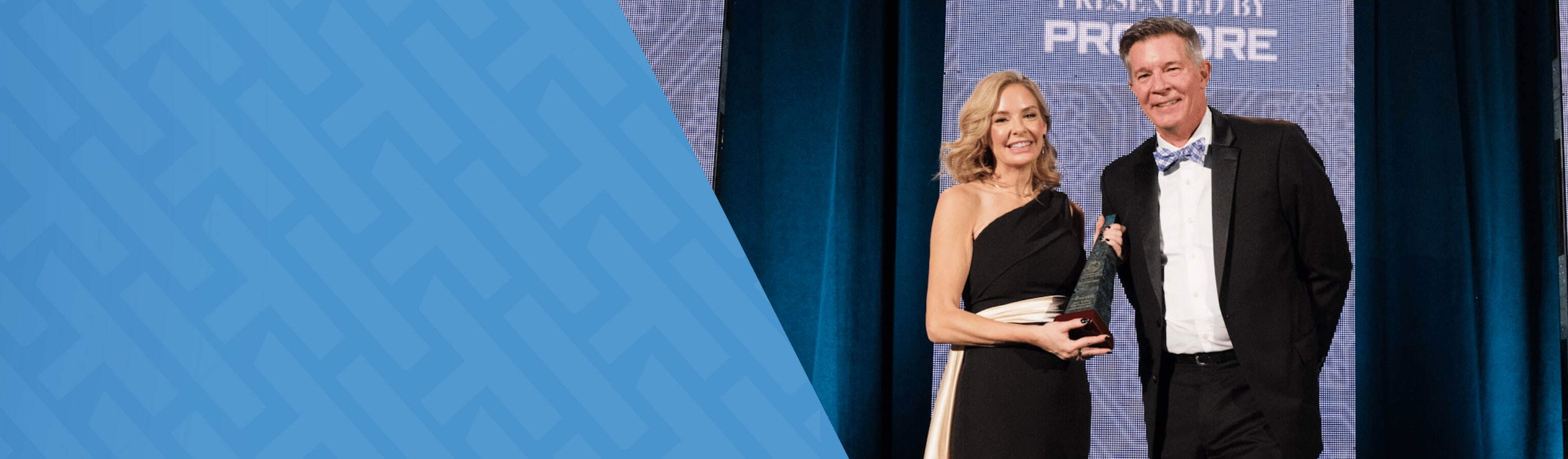 Image of Melvina Stacey , the Health and Safety Director for the Pacific West at Flatiron Dragados, who was named ‘2026 Harry Eckstein Safety Professional of the Year’ receiving her award, standing next to Doug Rubingh, CSO at HammerTech.