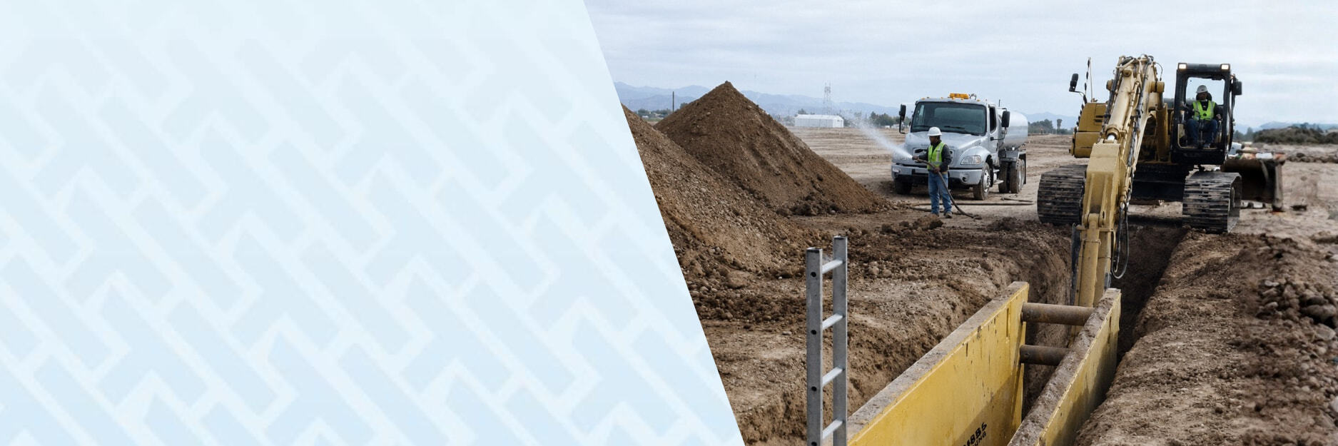 Image of excavation happening on a civil & infrastructure site with back hoe and trenching using HammerTEch for construction safety.