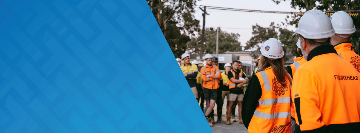 Figurehead case study email header showing Figurehead workers meeting on site in hivis