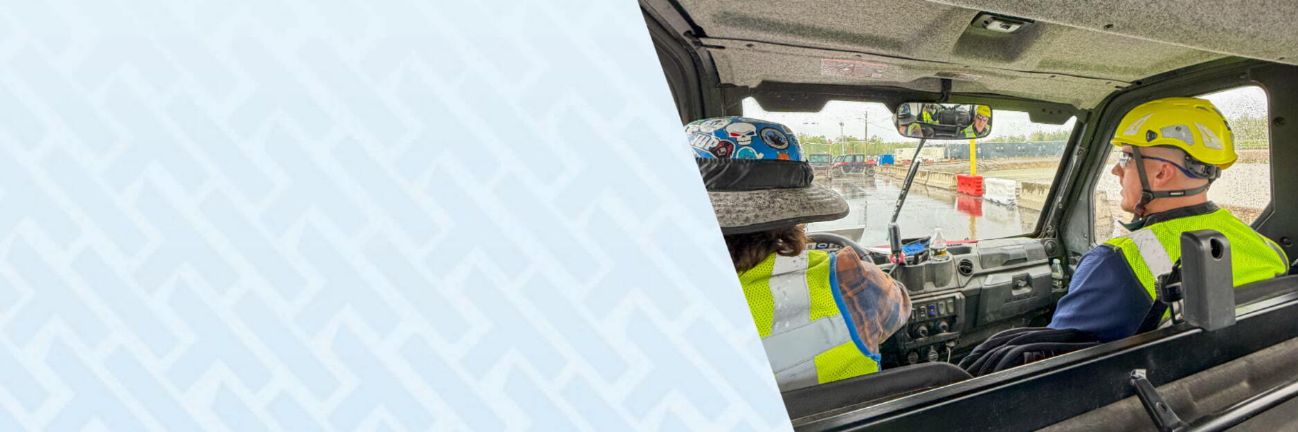 Holder Construction workers in a work vehicle on a job site using HammerTech construction safety platform