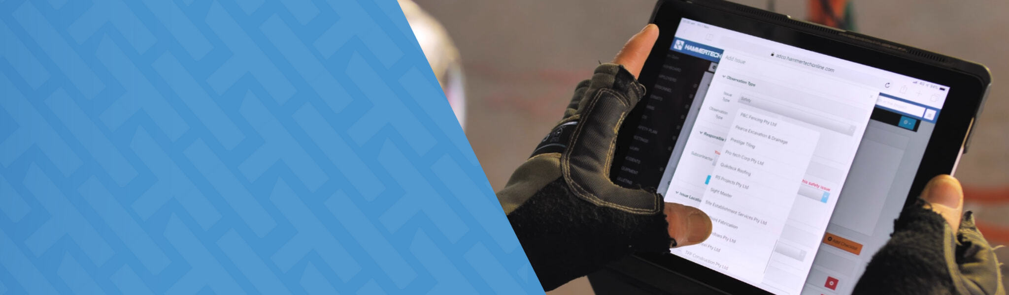 Image of a construction worker using a tablet for construction safety while on a job site.