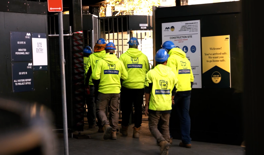 Image showing multiple workers heading on site through Irongate construction site access turnstiles with fast facial recognition.