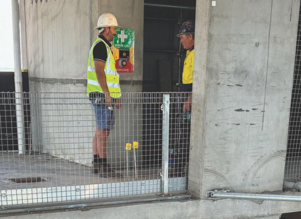 Orisent emergency alert system visible on working construction site