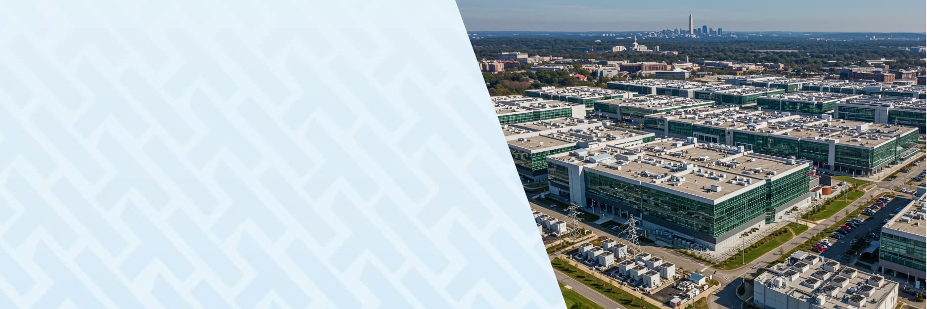 Aerial view of a large data center campus with multiple buildings, rooftop equipment, and surrounding urban infrastructure.