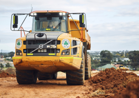 Shamrock Civil dump truck on a job site on dirt