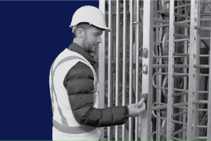 Construction worker passing through construction site turnstile in the UK for site safety and efficiency. 