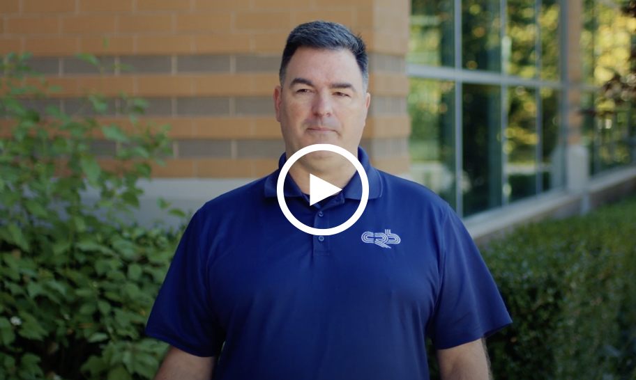 An image of Al Edinger, Superintendent at CRB Constrution with a play button over the front.  This links to a short clip that explains the benefits of HammerTech's construction safety software for general contractors. 